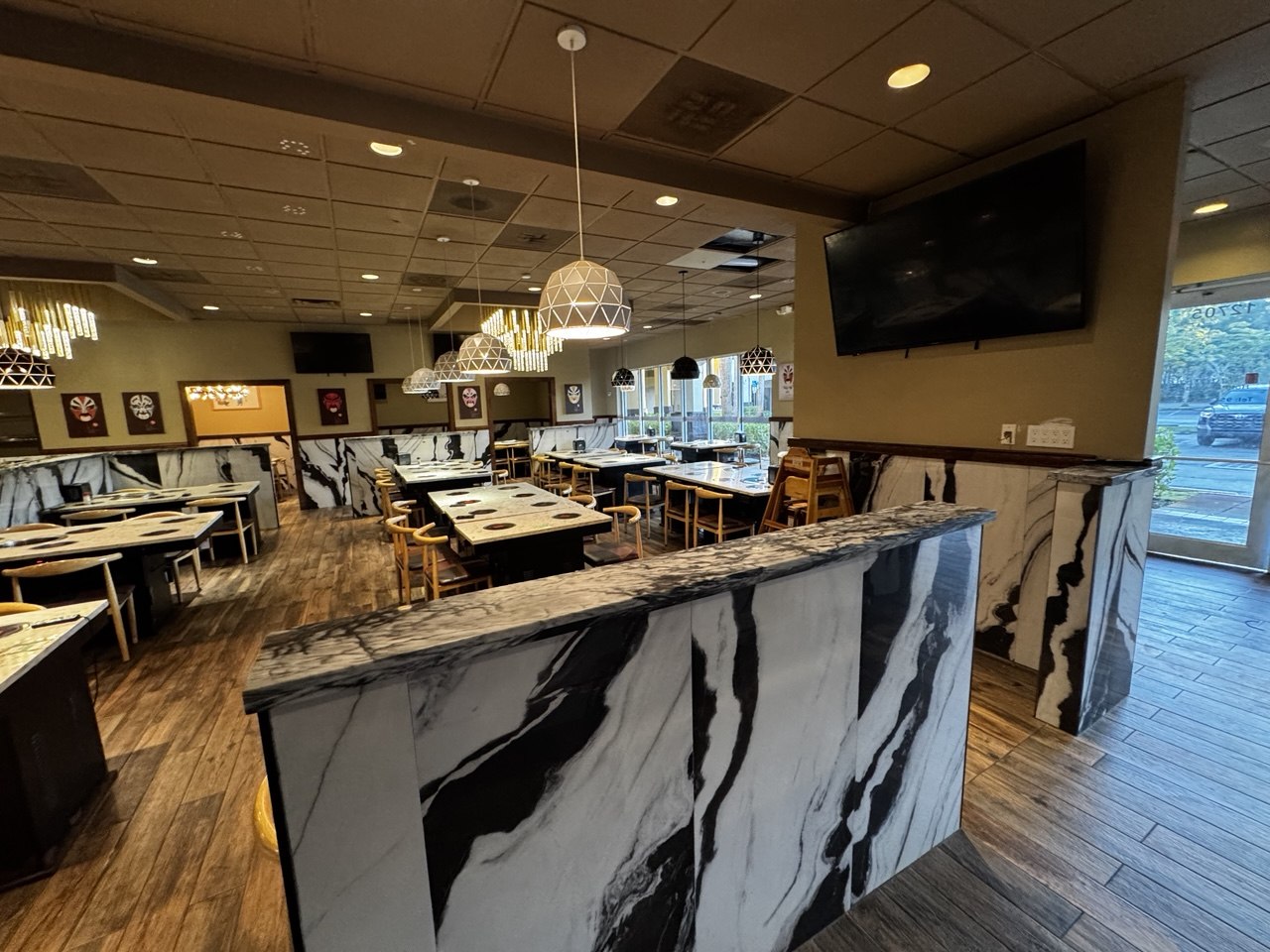 Front dining area and built-in hot pot tables before liquidation
