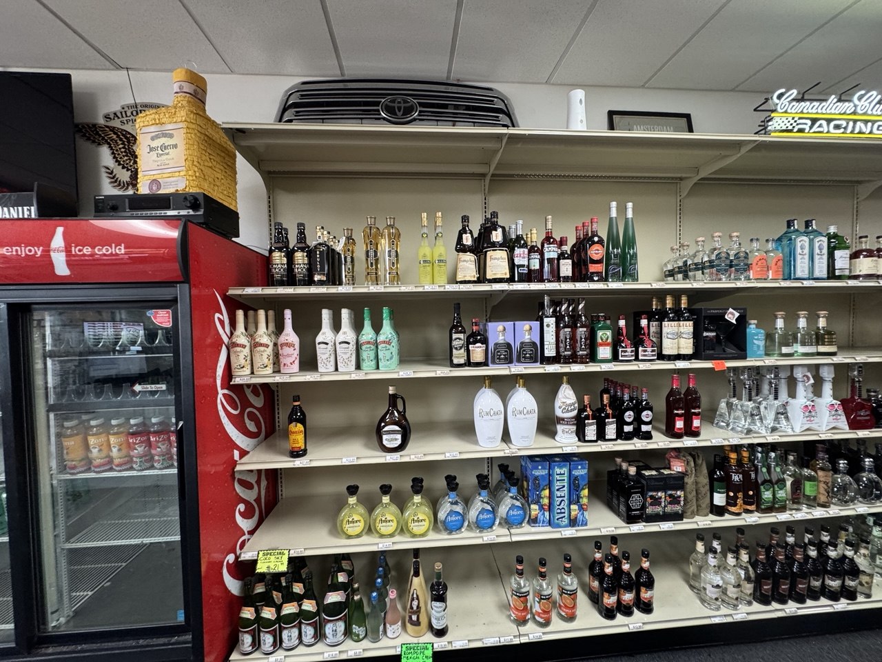 Liquor store shelving, cooler, and support fixtures included in short-notice liquidation